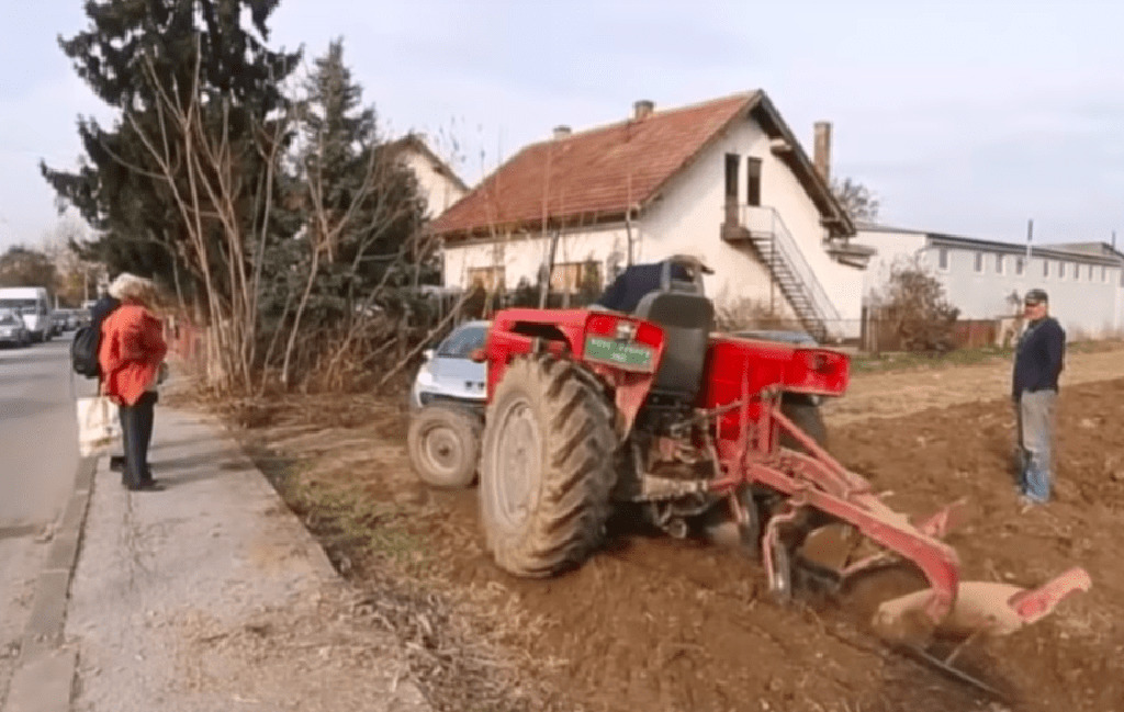 Red tractor on land 
