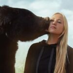bear kissing woman