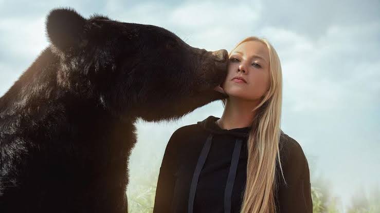 bear kissing woman