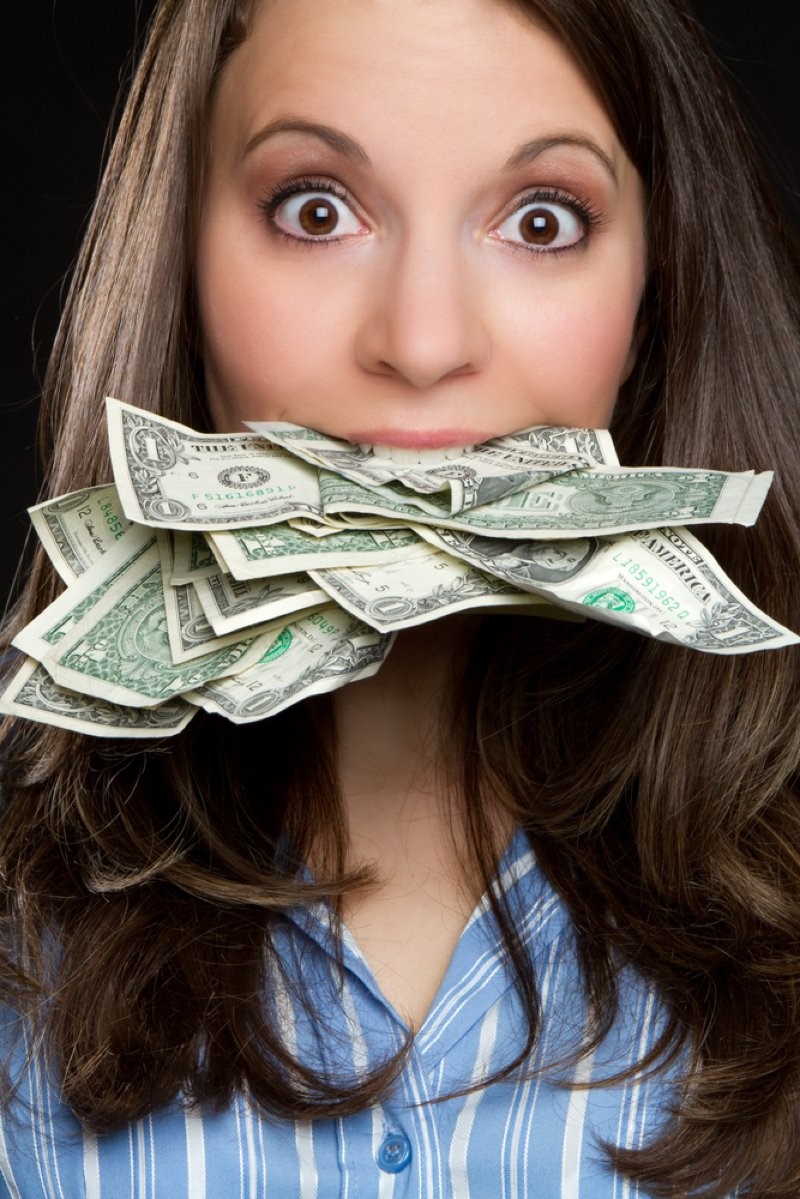 woman with money on her mouth