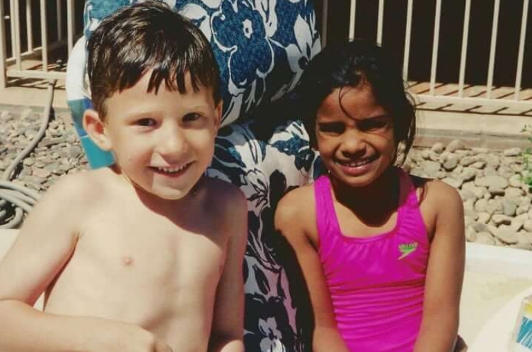 boy and girl at the pool in the sun