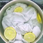 White shirt in a pot with lemon slices