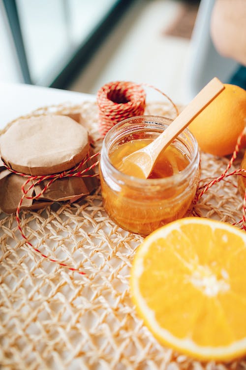 Free Jar of Honey and a Lemon Stock Photo